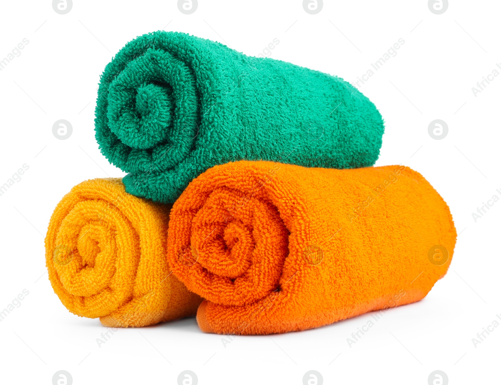 Photo of Colorful rolled terry towels isolated on white