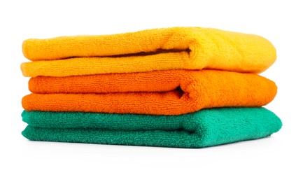 Photo of Stack of colorful terry towels isolated on white