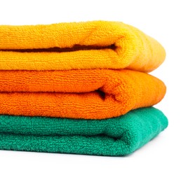 Photo of Stack of colorful terry towels isolated on white