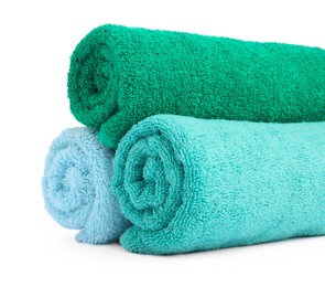 Photo of Colorful rolled terry towels isolated on white