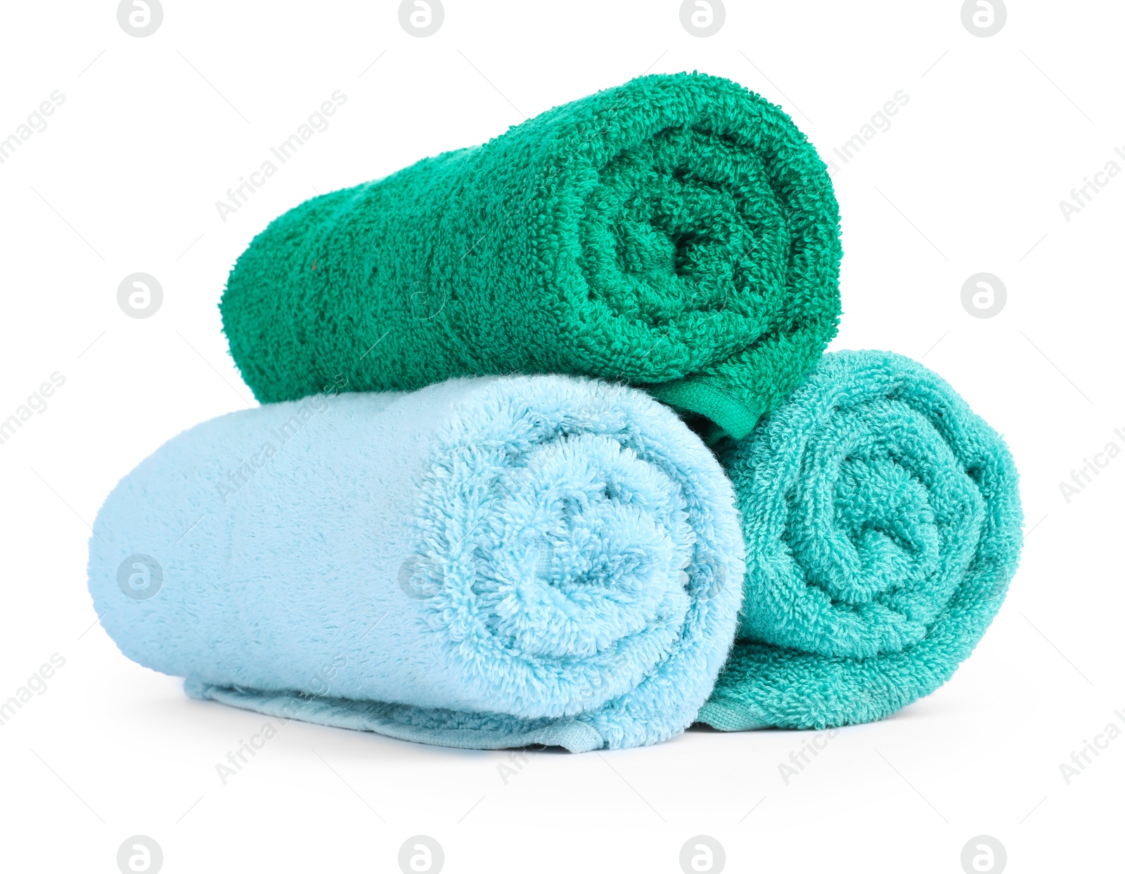 Photo of Colorful rolled terry towels isolated on white
