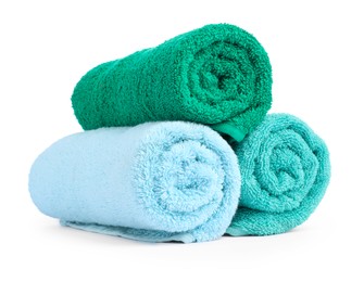 Photo of Colorful rolled terry towels isolated on white