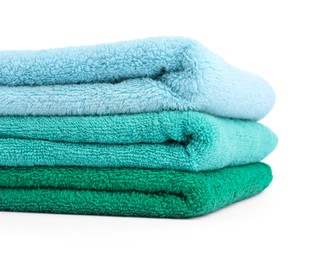 Photo of Stack of colorful terry towels isolated on white