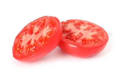Photo of Pieces of ripe red tomato isolated on white