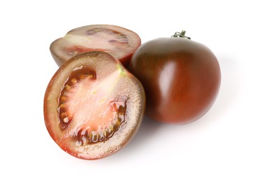 Photo of Pieces of ripe tomato isolated on white