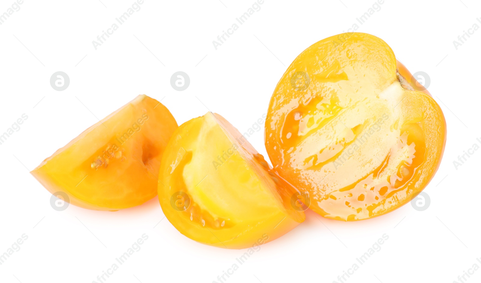 Photo of Pieces of ripe yellow tomato isolated on white