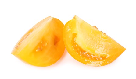 Photo of Pieces of ripe yellow tomato isolated on white