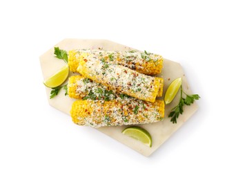 Photo of Tasty grilled corncobs with parsley, cheese and lime slices isolated on white, top view