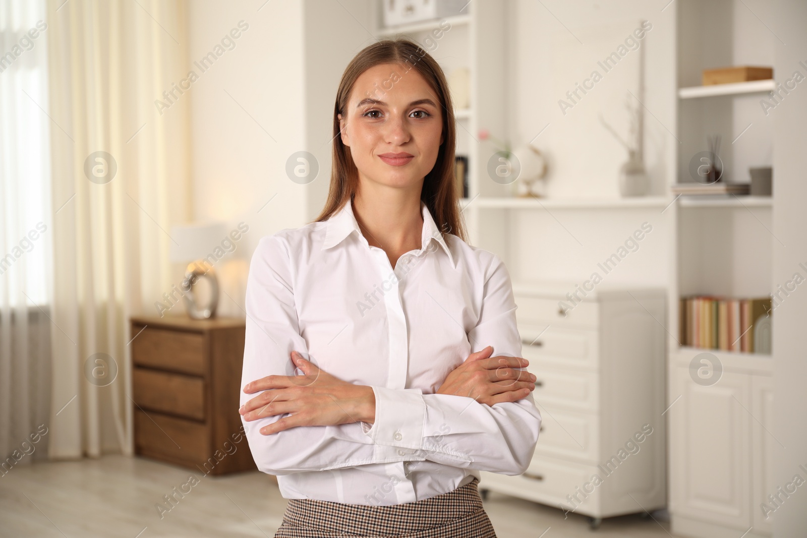 Photo of Portrait of beautiful young woman at home