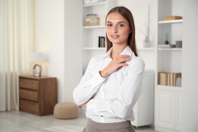 Photo of Portrait of beautiful young woman at home. Space for text