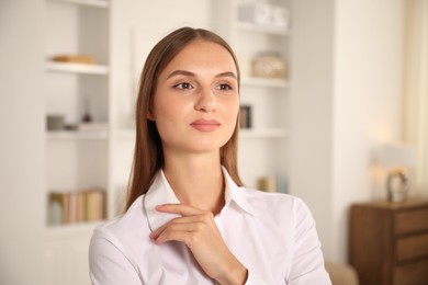 Photo of Portrait of beautiful young woman at home