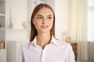 Photo of Portrait of beautiful young woman at home