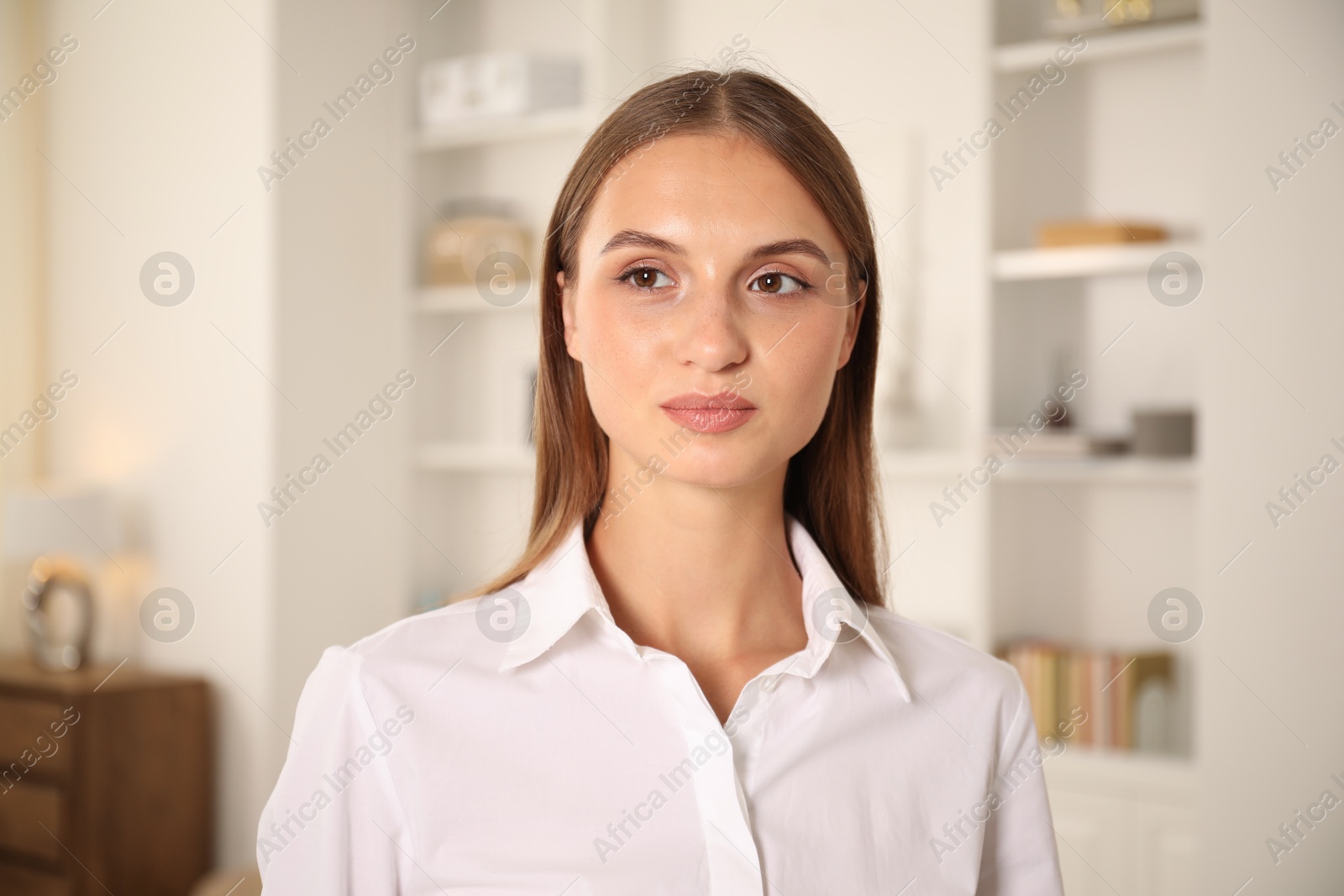 Photo of Portrait of beautiful young woman at home