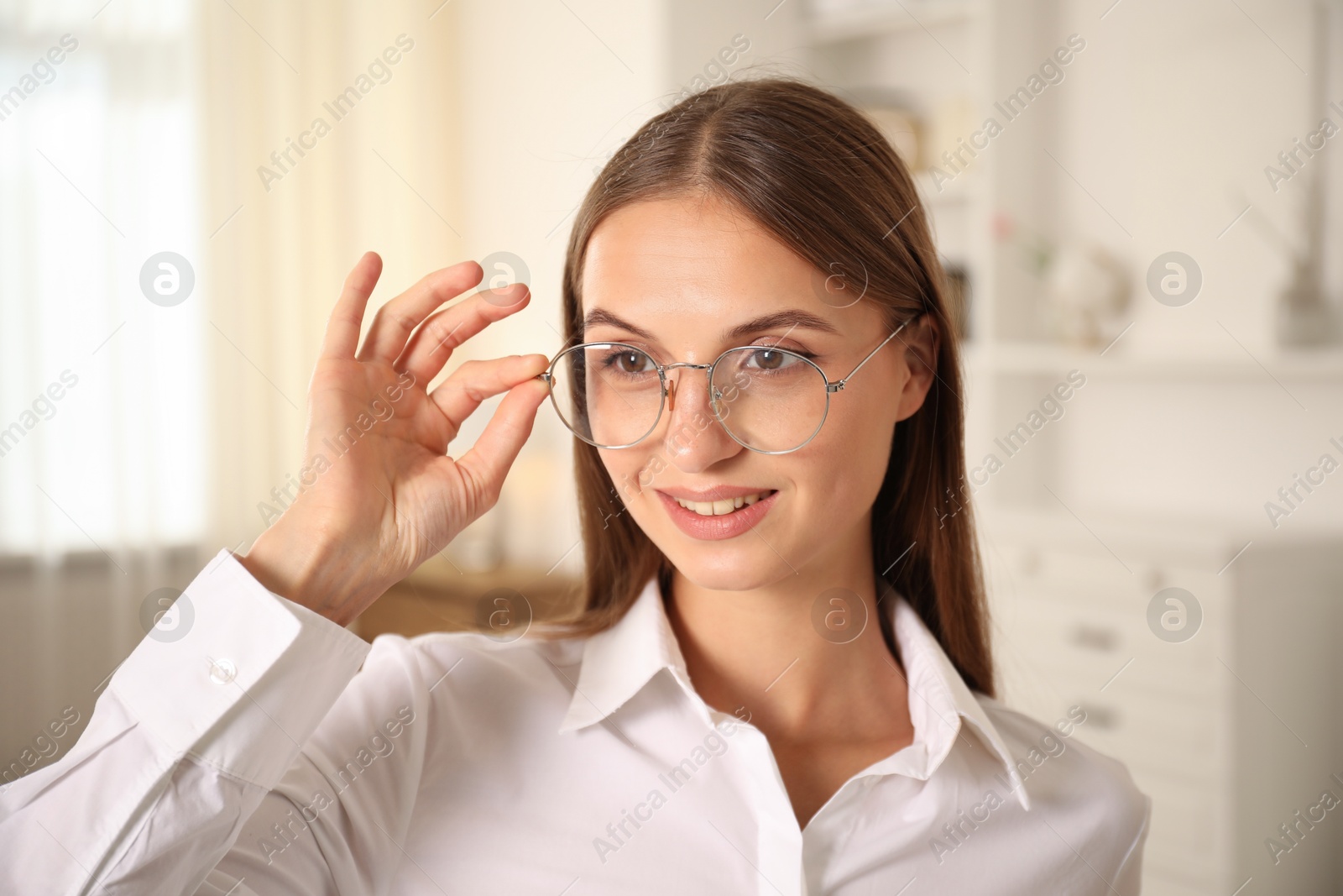 Photo of Portrait of beautiful young woman at home