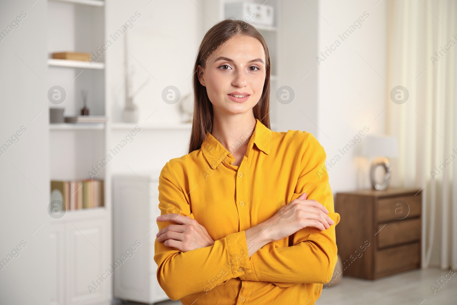 Photo of Portrait of beautiful young woman at home