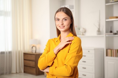 Photo of Portrait of beautiful young woman at home