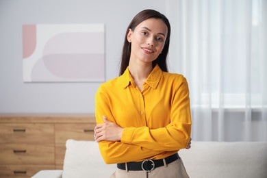 Photo of Portrait of beautiful young woman at home