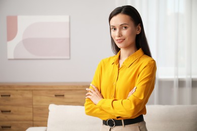 Photo of Portrait of beautiful young woman at home. Space for text