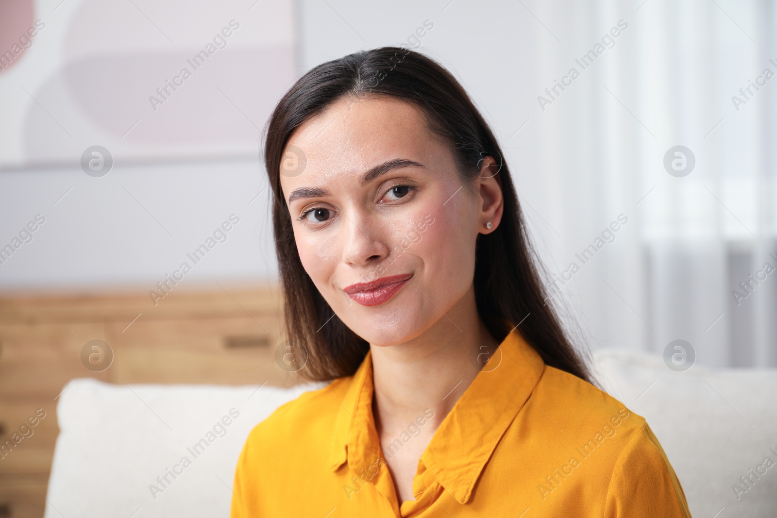 Photo of Portrait of beautiful young woman at home
