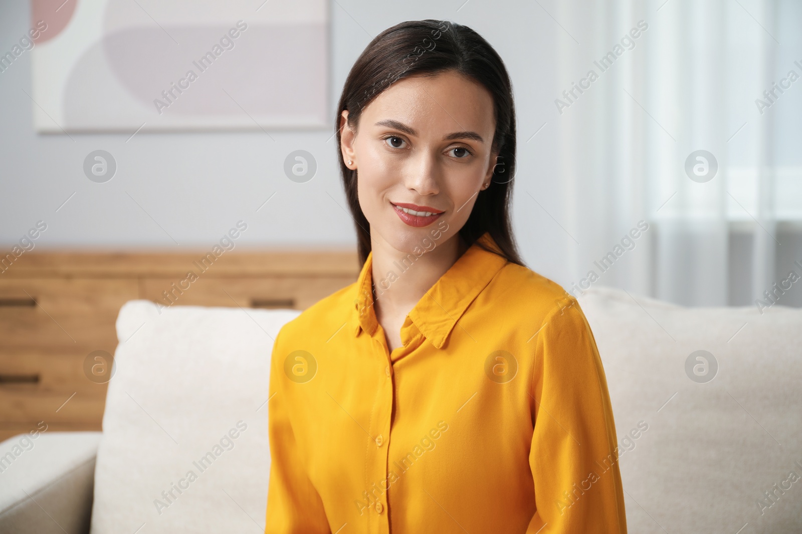 Photo of Portrait of beautiful young woman at home