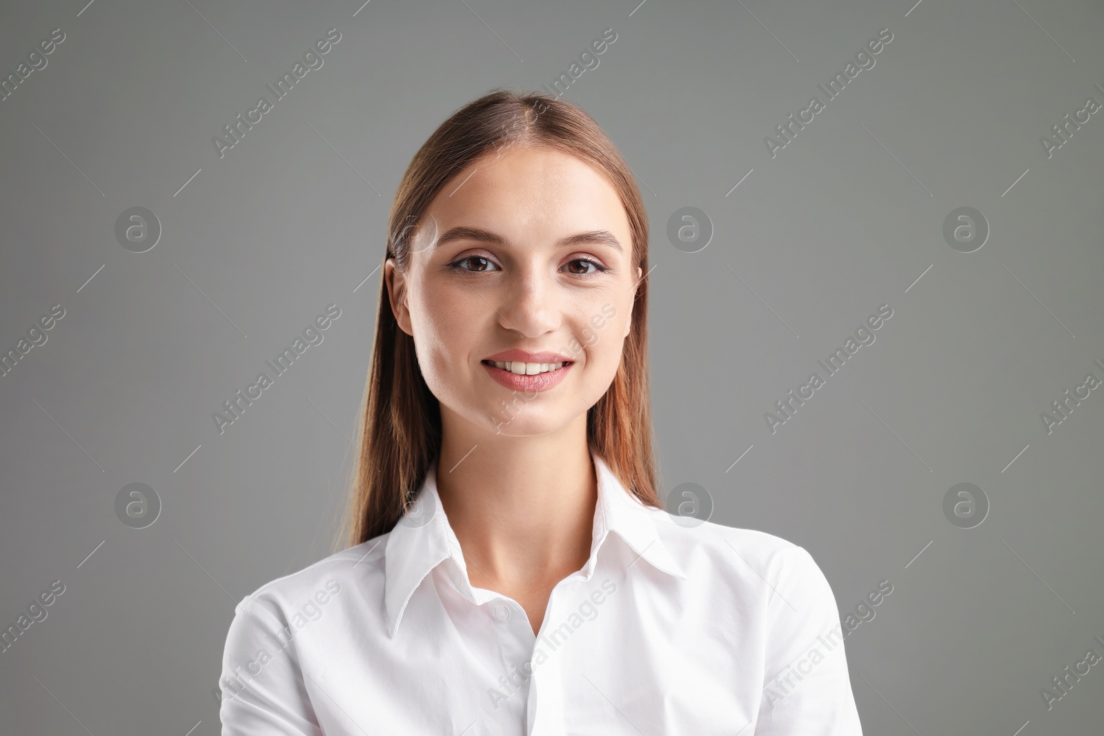 Photo of Portrait of confident businesswoman on grey background