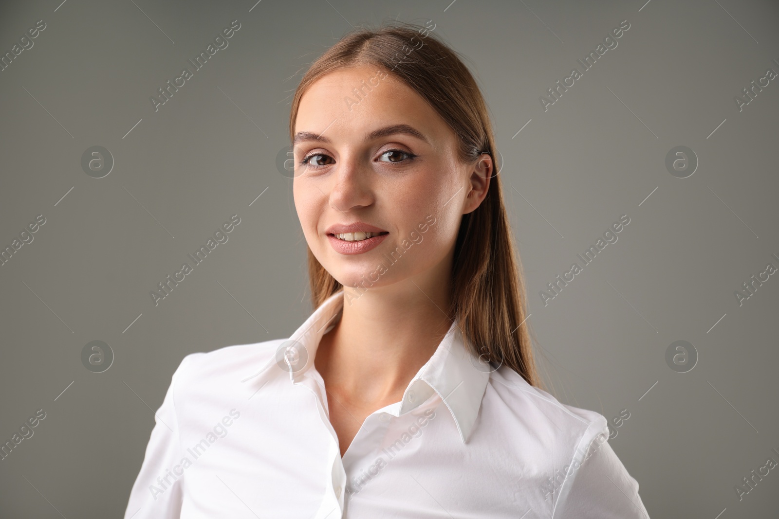 Photo of Portrait of confident businesswoman on grey background