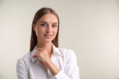 Photo of Portrait of beautiful woman on white background. Space for text