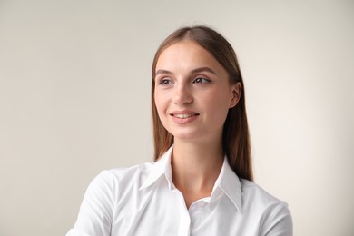 Photo of Portrait of beautiful woman on white background