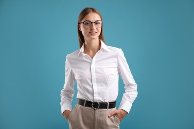 Photo of Portrait of beautiful woman on blue background