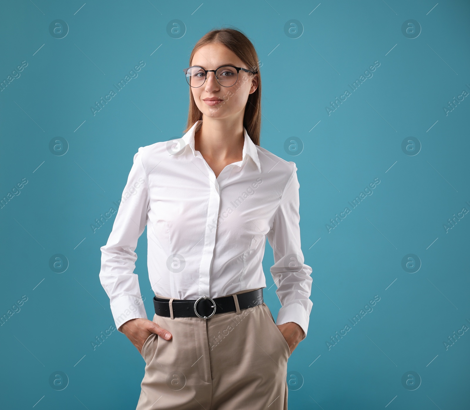 Photo of Portrait of beautiful woman on blue background