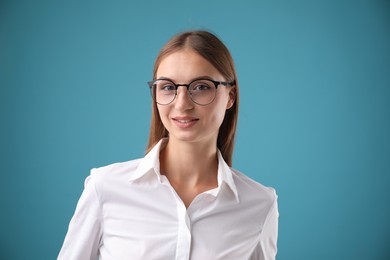 Photo of Portrait of beautiful woman on blue background