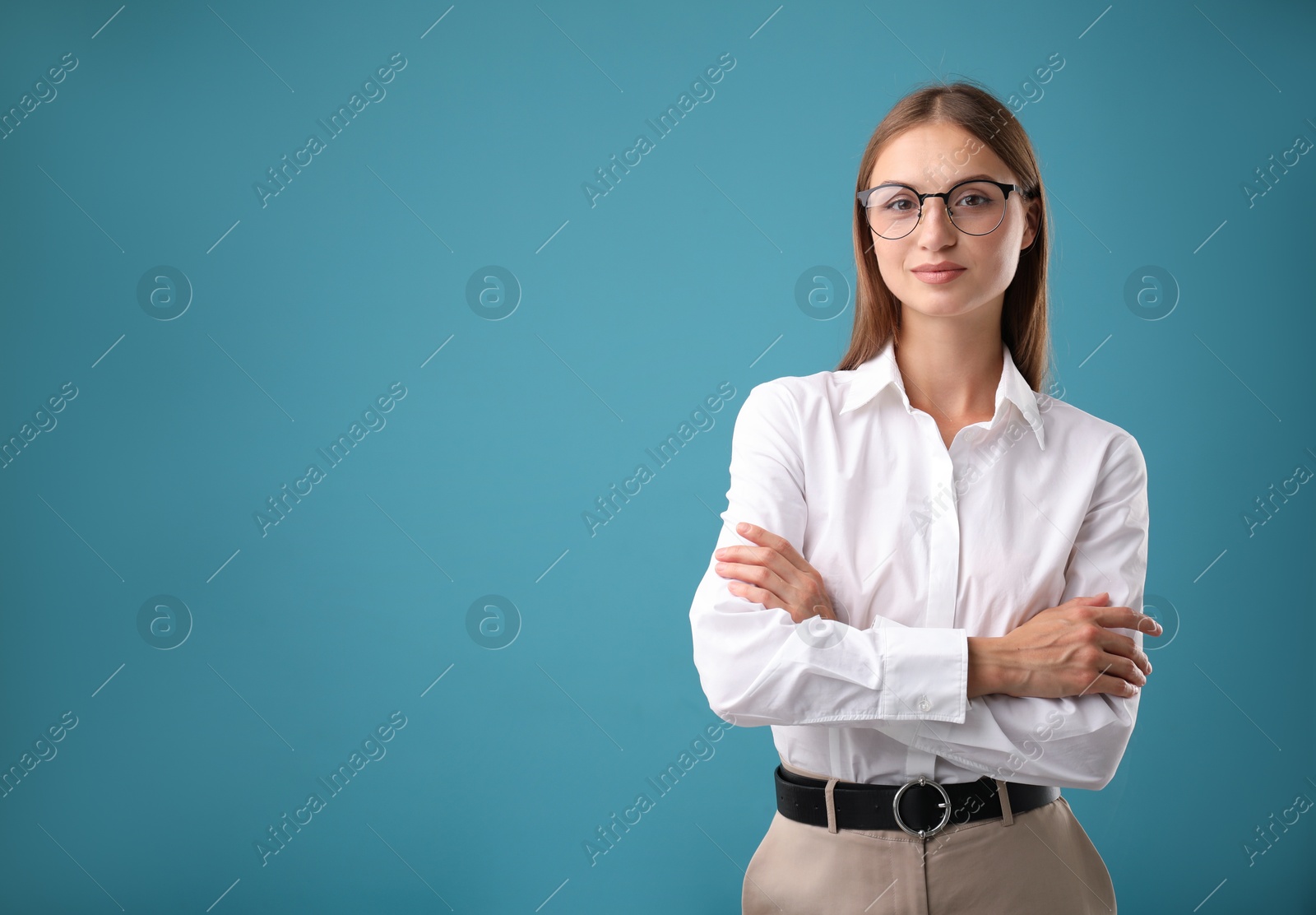 Photo of Portrait of beautiful woman on blue background. Space for text