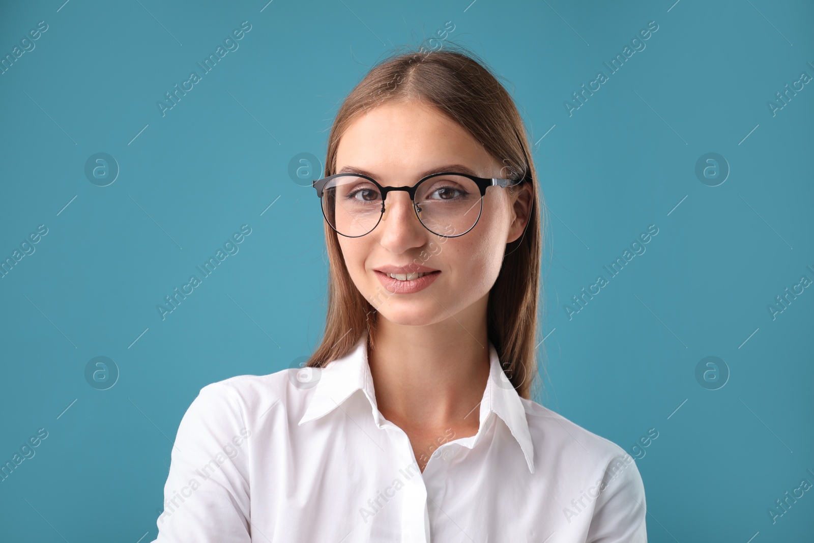 Photo of Portrait of beautiful woman on blue background