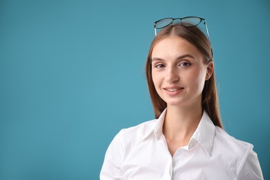 Photo of Portrait of beautiful woman on blue background. Space for text