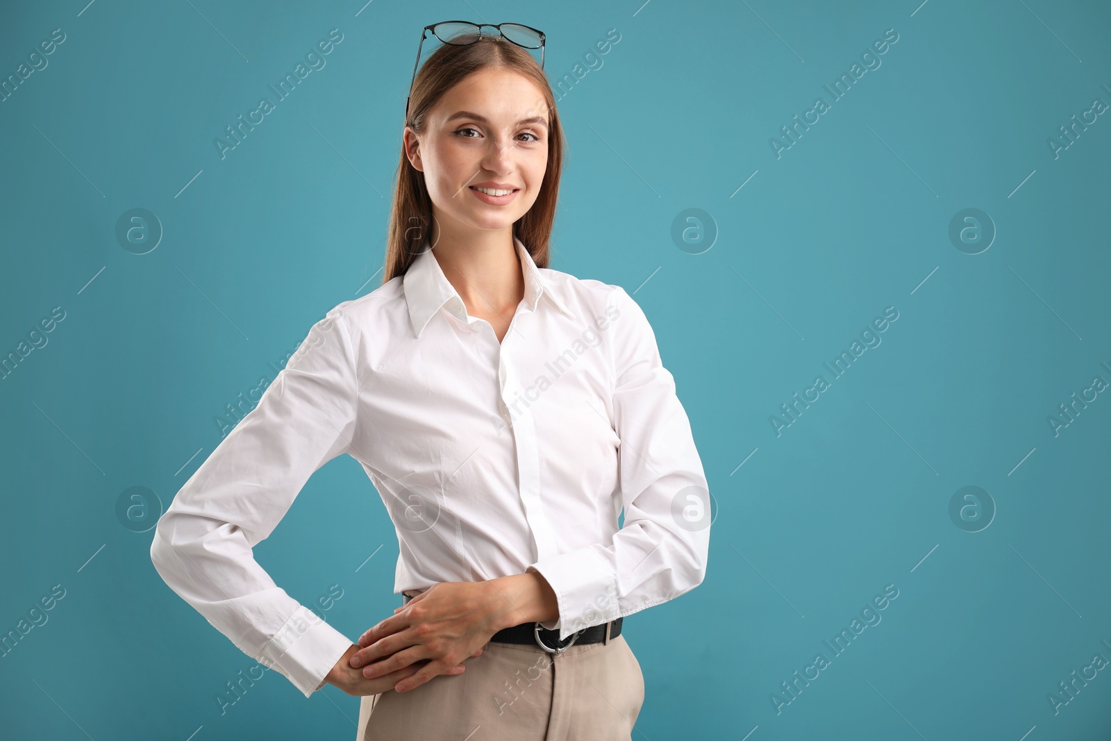 Photo of Portrait of beautiful woman on blue background. Space for text