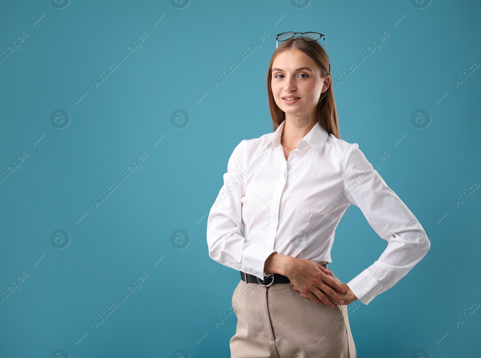 Photo of Portrait of beautiful woman on blue background. Space for text