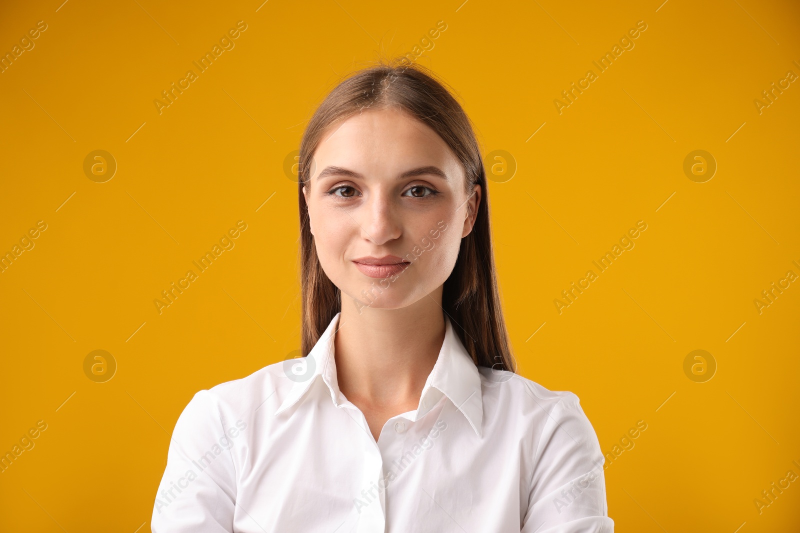 Photo of Portrait of beautiful woman on yellow background