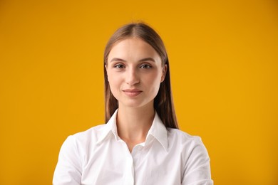 Photo of Portrait of beautiful woman on yellow background