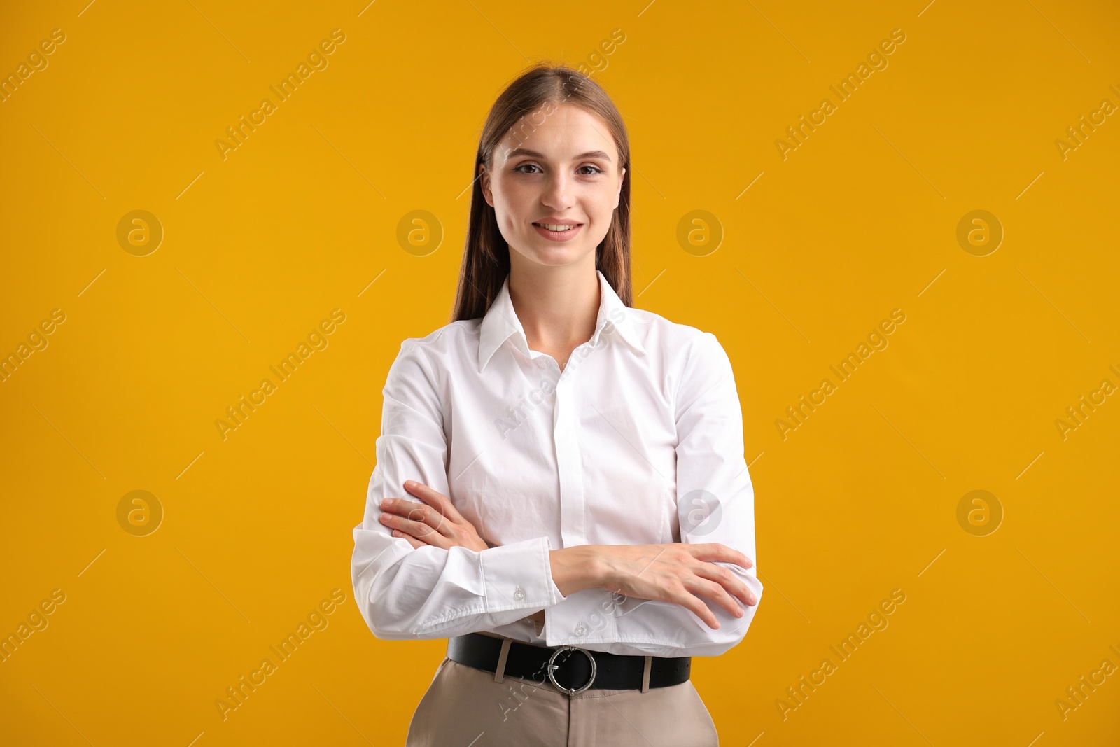 Photo of Portrait of beautiful woman on yellow background