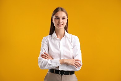 Photo of Portrait of beautiful woman on yellow background