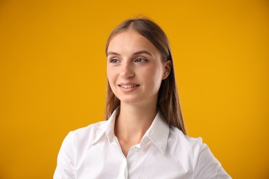 Photo of Portrait of beautiful woman on yellow background