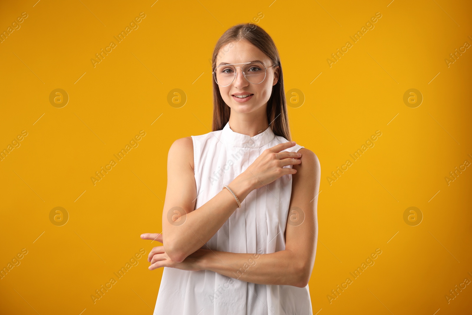 Photo of Portrait of beautiful woman on yellow background