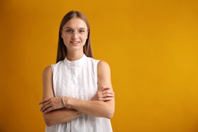 Photo of Portrait of beautiful woman on yellow background. Space for text