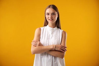 Photo of Portrait of beautiful woman on yellow background