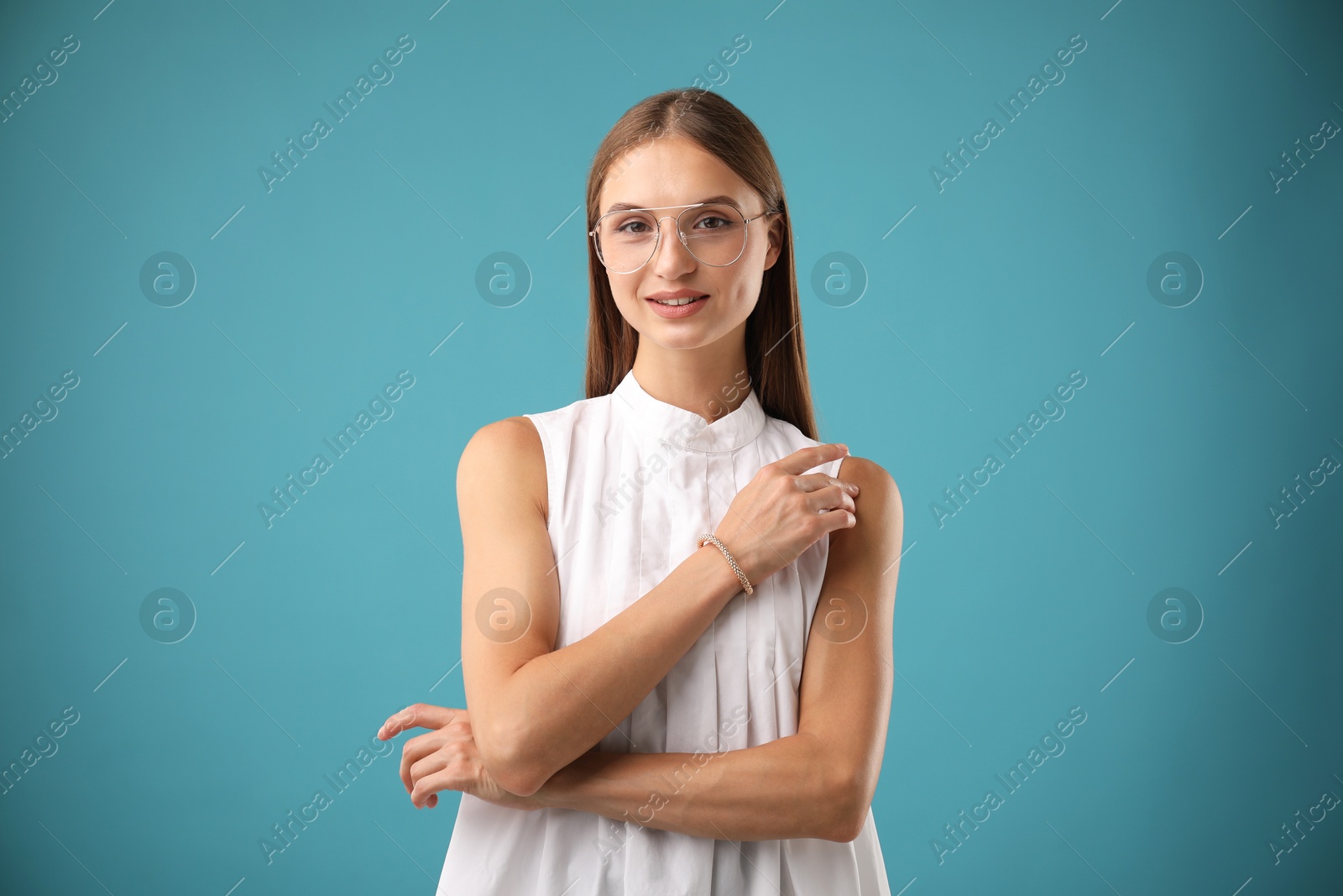 Photo of Portrait of beautiful woman on light blue background