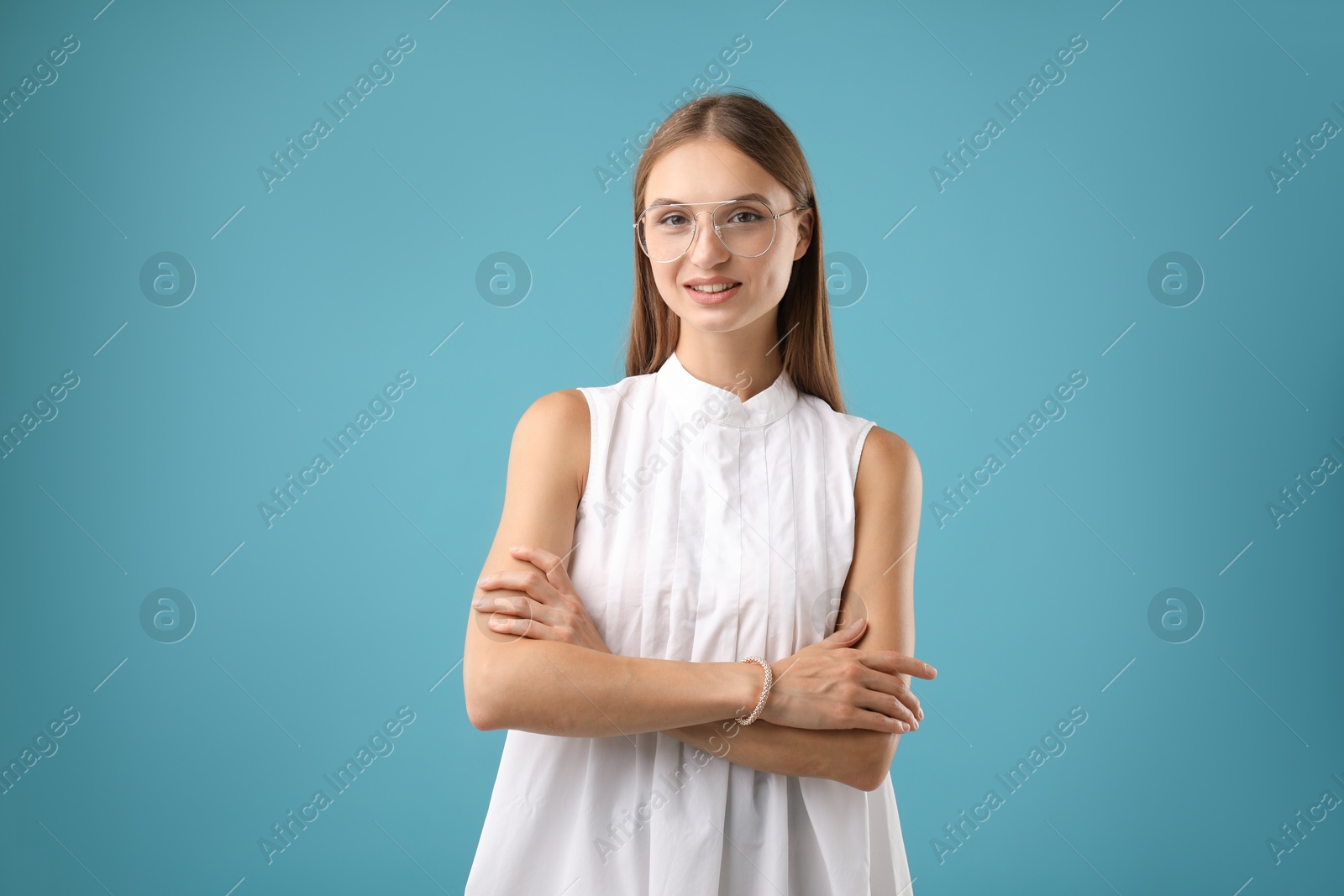 Photo of Portrait of beautiful woman on light blue background