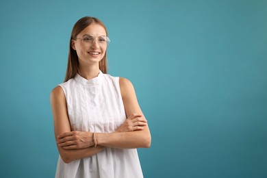 Photo of Portrait of beautiful woman on light blue background. Space for text