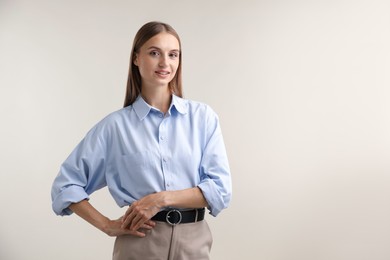 Photo of Portrait of beautiful woman on light background. Space for text