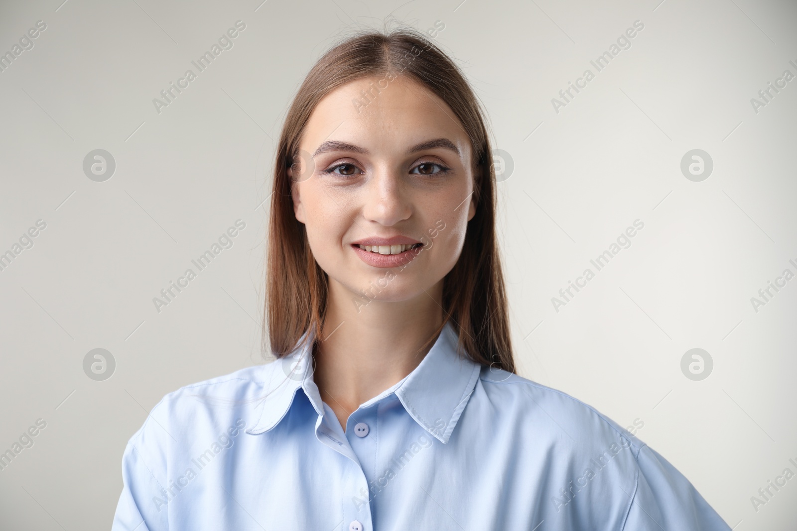 Photo of Portrait of beautiful woman on light background