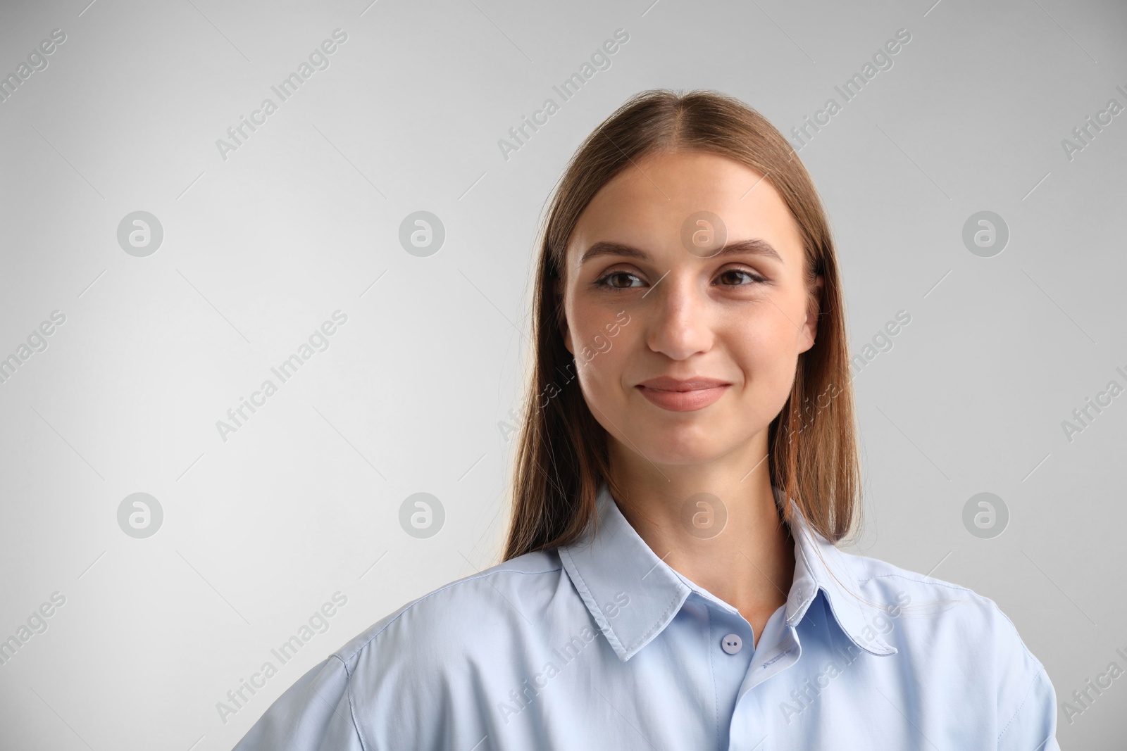 Photo of Portrait of beautiful woman on light background. Space for text